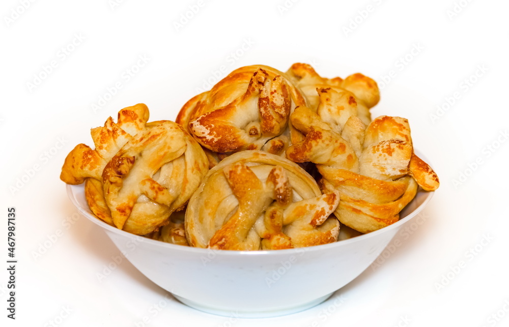 Homemade bread rolls with sugar in a white ceramic plate on a white background Homemade bread rolls with sugar in a white ceramic plate on a white background