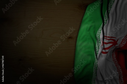 nice labor day flag 3d illustration. - dark photo of Iran flag with big folds on dark wood with empty space for your content photo