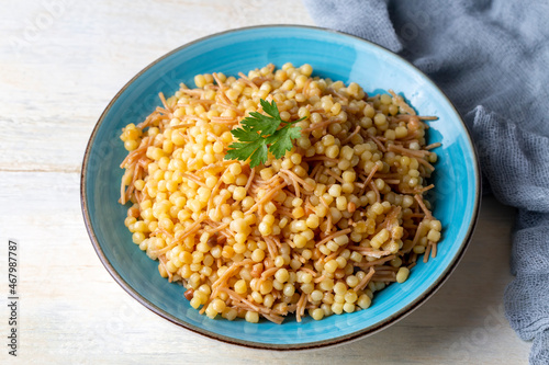 Traditional delicious Turkish food; Couscous pilaf with vermicelli (Turkish name; Sehriyeli kuskus pilavi)