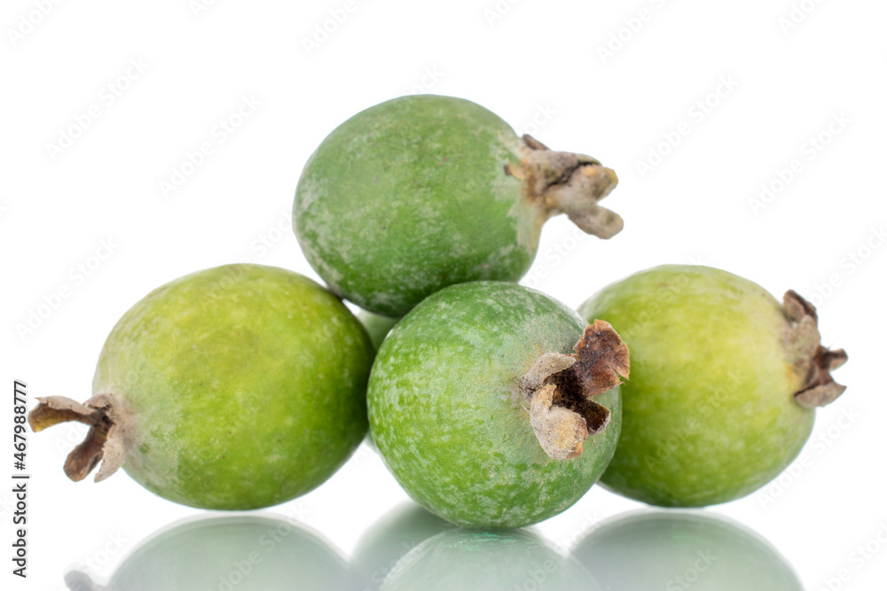 Several ripe sweet feijoa fruits, close-up, isolated on white. Several ripe sweet feijoa fruits, close-up, isolated on white.