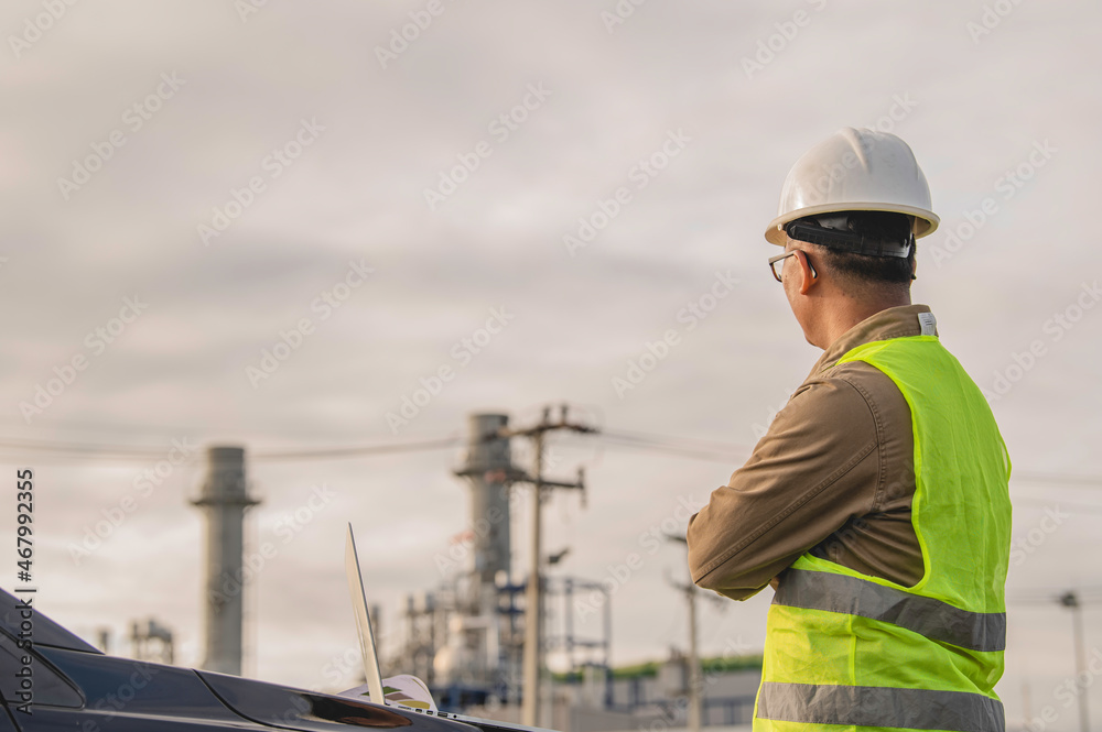 Asian man petrochemical engineer working at oil and gas refinery plant industry factory,The people worker man engineer work control at power plant energy industry manufacturing Asian man petrochemical engineer working at oil and gas refinery plant industry factory,The people worker man engineer work control at power plant energy industry manufacturing