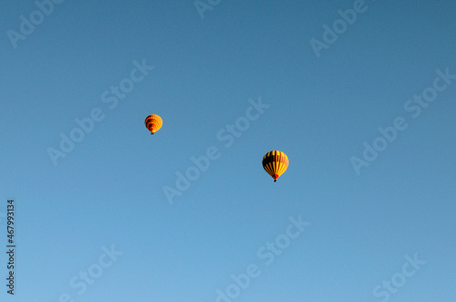 Air balloons festival in Cappadocia. Hot air balloons against blue sky. Colorful vibrant sky