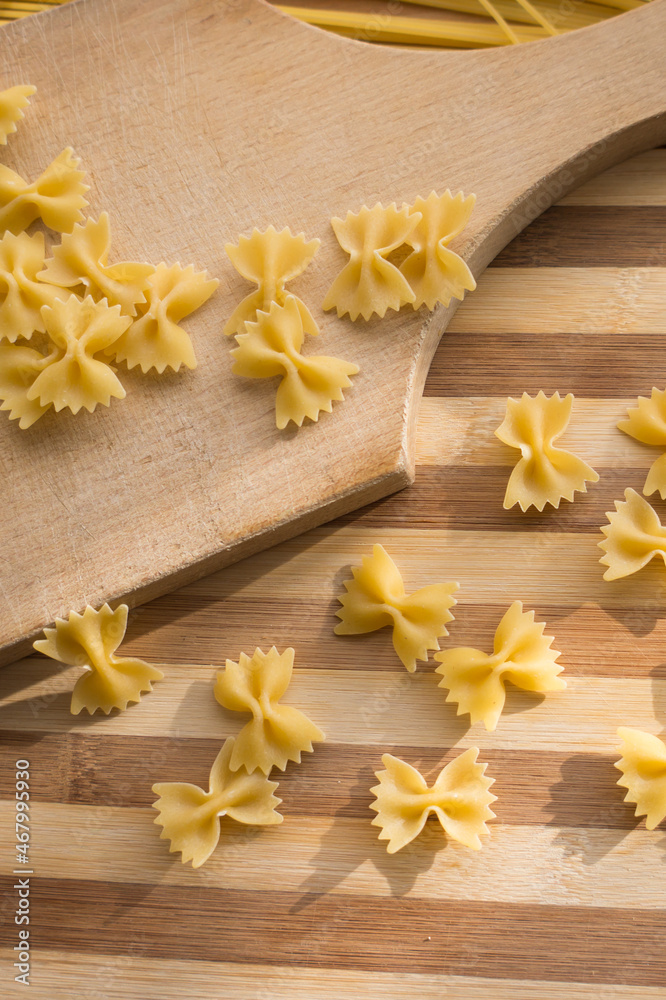Different types of pasta Cellentani, Tortiglioni, Farfalle, spaghetti are often used in the kitchen for cooking.