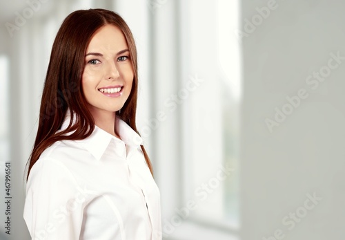 Portrait of a beautiful woman smiling while looking at camera.