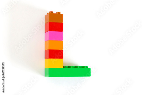 Colorful toy brick letter L