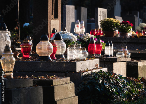 Cemetery grave candle lanterns. All Saints' Day, Feast of All Souls. Commemoration of All the Faithful Departed and the Day of the Dead.