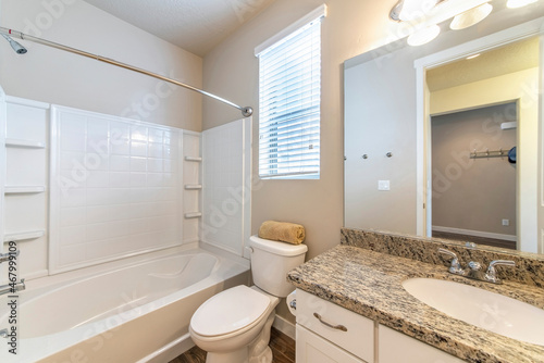 Bathroom interior with window and acrylic bathtub wall kit photo