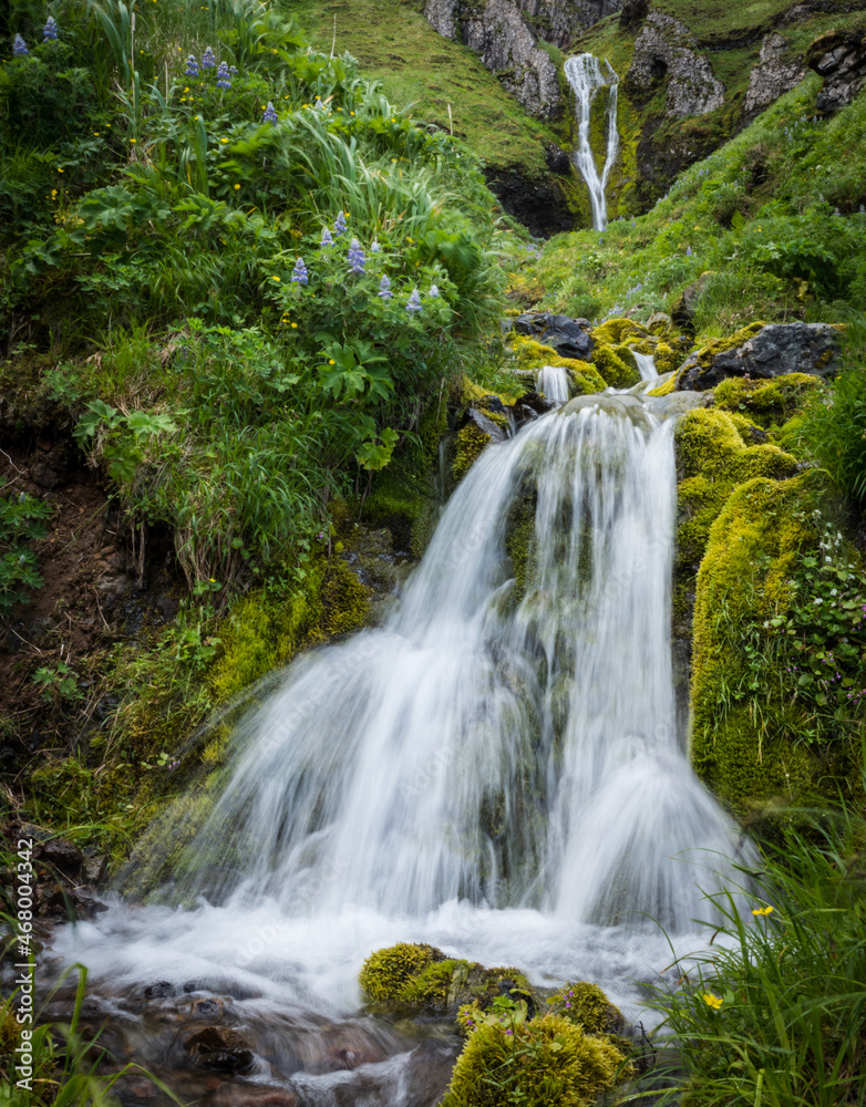 Obraz premium A waterfall on Umnak Island in Alaska's Aleutian Islands. Alaska Maritime National Wildlife Refuge.