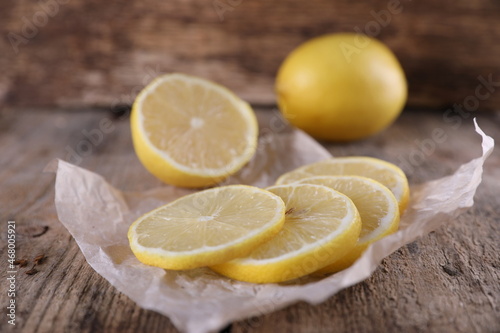 Juicy ripe lemon on a dark old wooden background