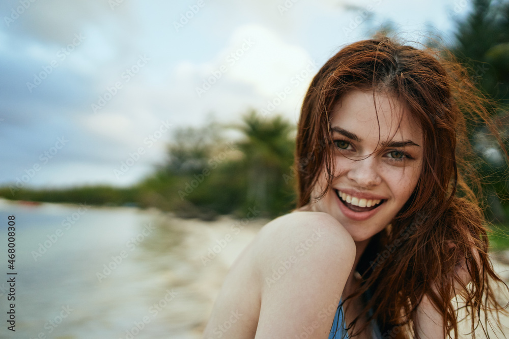 woman in blue swimsuit on the beach island lifestyle woman in blue swimsuit on the beach island lifestyle