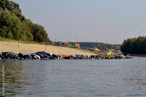 Different boats anchored on the beach ,, Podul4 ,, arranged on the Borcea arm, near the town of Calarasi  photo
