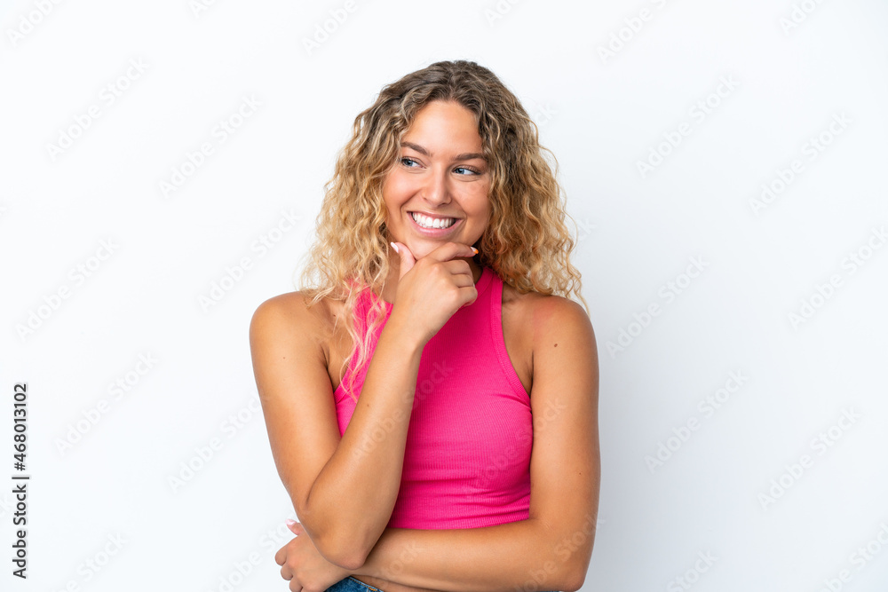 Girl with curly hair isolated on white background looking to the side and smiling Girl with curly hair isolated on white background looking to the side and smiling