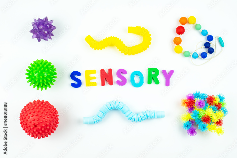 Sensory word and colorful balls that magically bunch. Sensory training, sensory integration, dysfunction and processing disorder. Sensory toy, creativity, fine motor skills, occupational therapy - obrazy, fototapety, plakaty 