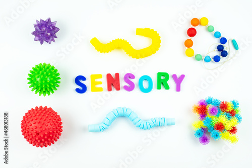 Sensory word and colorful balls that magically bunch. Sensory training, sensory integration, dysfunction and processing disorder. Sensory toy, creativity, fine motor skills, occupational therapy