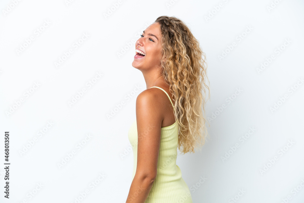 Fototapeta premium Girl with curly hair isolated on white background laughing in lateral position
