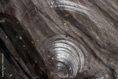 Macro stone mineral obsidian on a black background photo