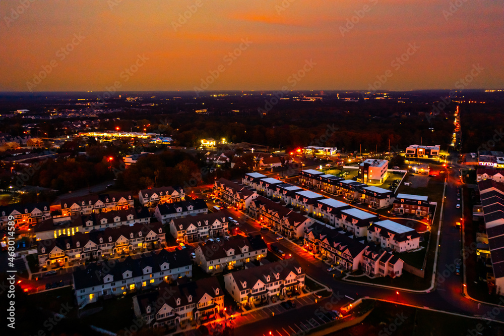 aerial image of a red sunset over a town 