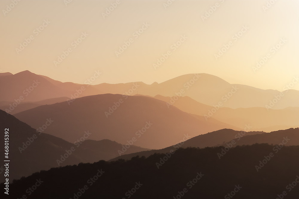 Silhouette of mountains in the setting rays of the sun, Peloponnese, Greece