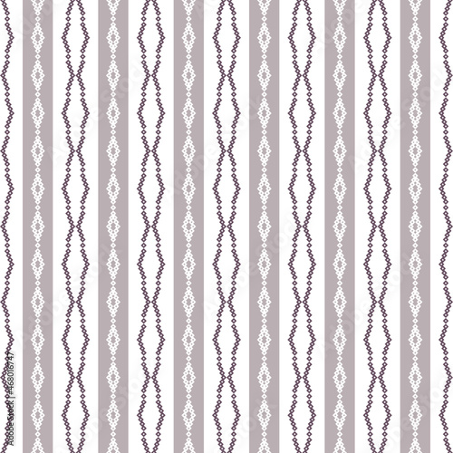 Geometric seamless pattern of purple squares in a flat style ornament in the form of pixels. Vertical embroidery dotted schemes. Textile geo prints.