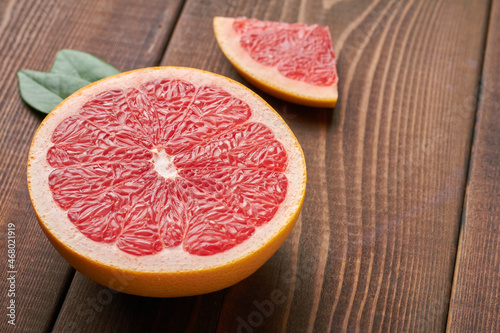 grapefruit on brown background copy space