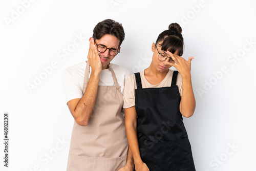 Restaurant mixed race waiters isolated on white background unhappy and frustrated with something