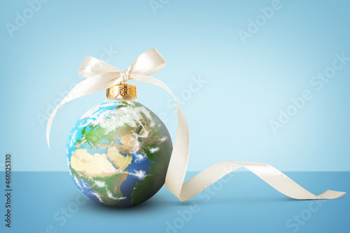 Fototapeta Naklejka Na Ścianę i Meble -  Beautiful balls with planet Earth on blue background