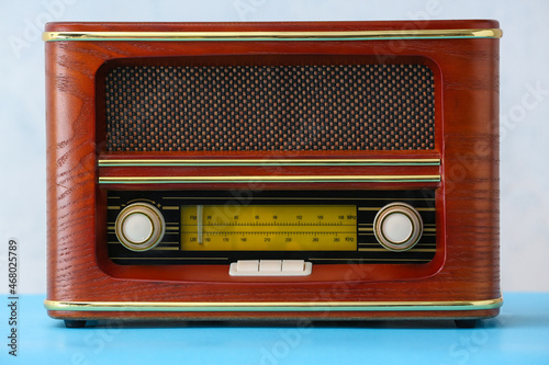 Retro radio receiver on light background
