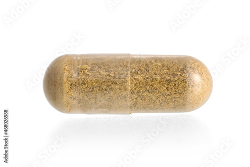 Vitamin K capsule on white background photo
