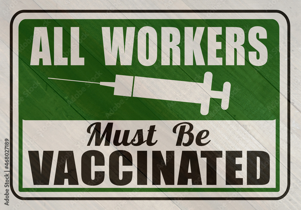 Vaccination is required sign on wood grain texture Vaccination is required sign on wood grain texture