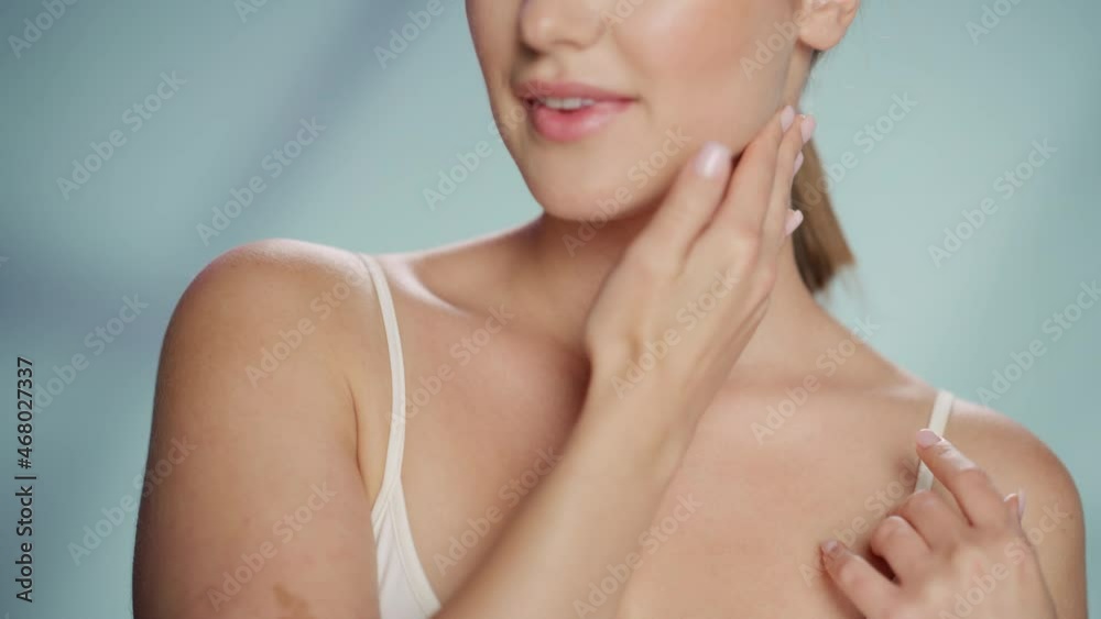 Female Beauty Portrait. Happy Caucasian Woman with Brown Hair Touching Natural, Healthy Skin, Using Sunscreen, Applying Nourishing Face Cream. Cosmetics and Skincare Concept on Isolated Background. Female Beauty Portrait. Happy Caucasian Woman with Brown Hair Touching Natural, Healthy Skin, Using Sunscreen, Applying Nourishing Face Cream. Cosmetics and Skincare Concept on Isolated Background.