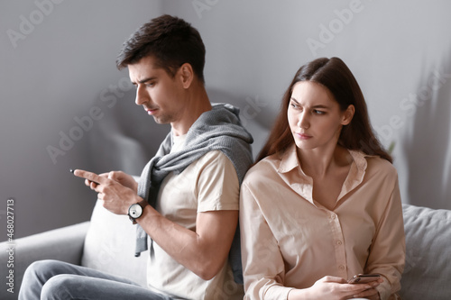 Young couple using mobile p...