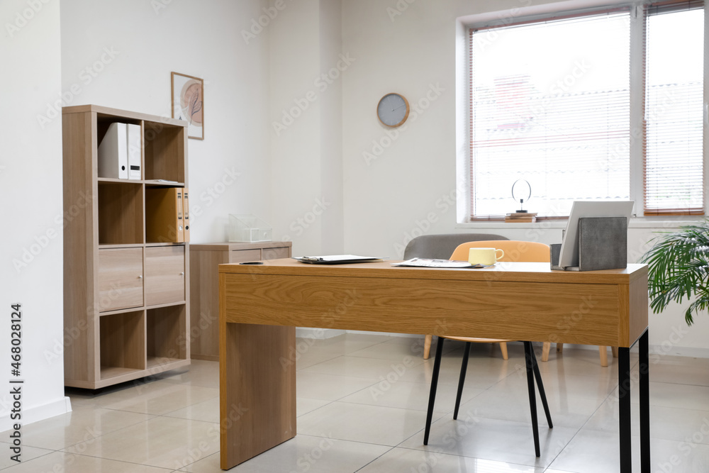 Stylish office workplace near window Stylish office workplace near window