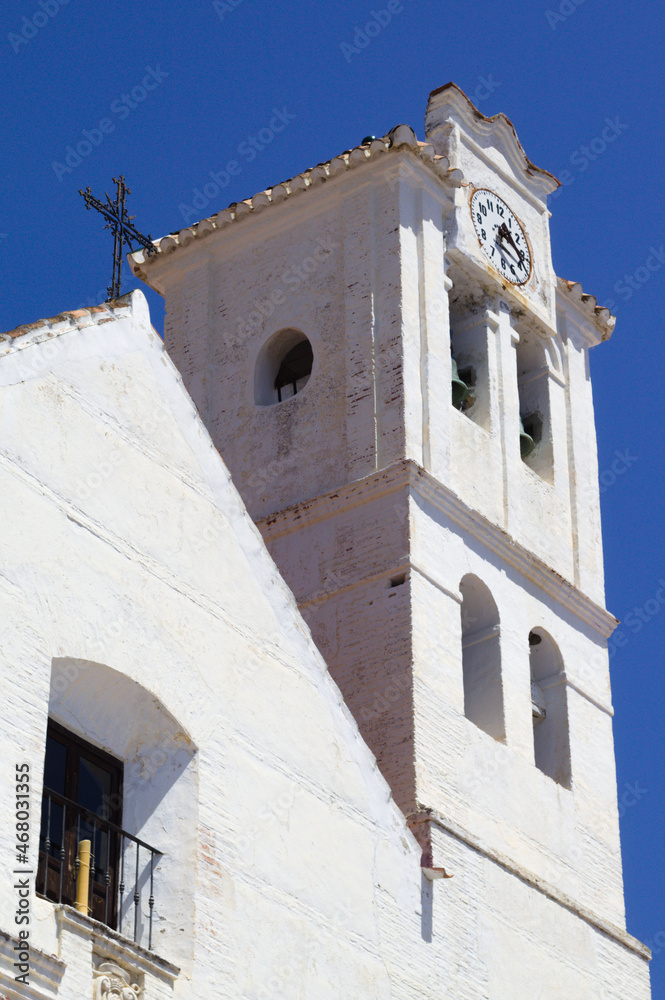 Beautiful Frigiliana village, Spain.The old church in the town square.  View of the historic building and it's bell tower.  Vertical shot with copy space.