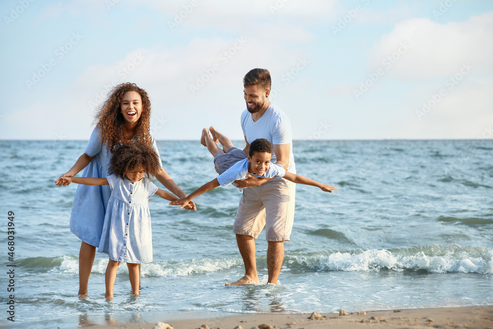 Happy family on sea beach