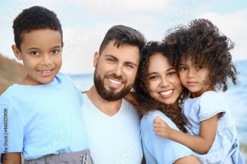 Happy family on sea beach