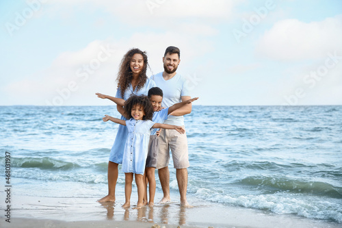 Happy family on sea beach
