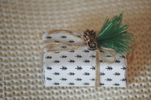 gift box with ribbon, gift box on a blurry knitted background.