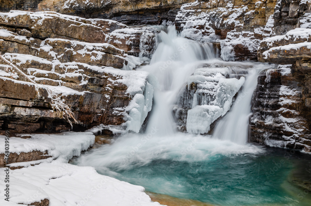 Obraz premium Little Icy waterfall, Johnston Canyon winter scene, small waterfall upstream of the upper fall