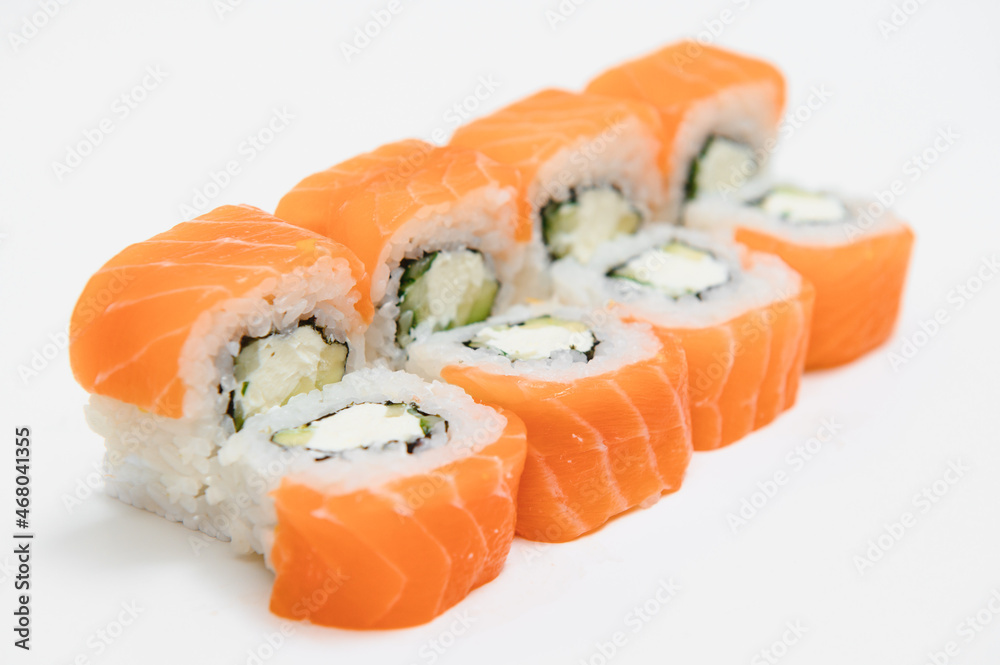 Uramaki. Philadelphia classic. Salmon, Philadelphia cheese, cucumber, avocado, tobiko Uramaki. Philadelphia classic. Salmon, Philadelphia cheese, cucumber, avocado, tobiko