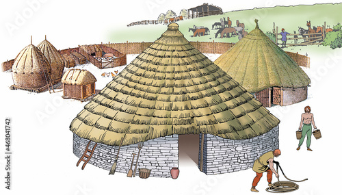 The Celtic house was usually circular, with a large sloping roof of straw and walls made of stone or wood photo