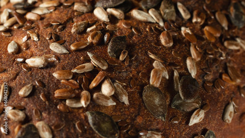 Close-up surface of homemade whole grain bread, food background, texture © Галина Сандалова