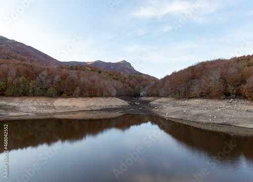 Reservoir in autumn with colorful trees