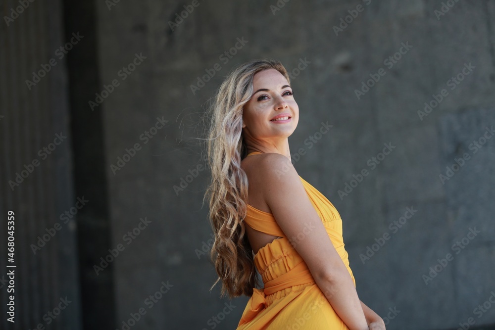 Beautiful young woman walking on street enjoying vacation during summer