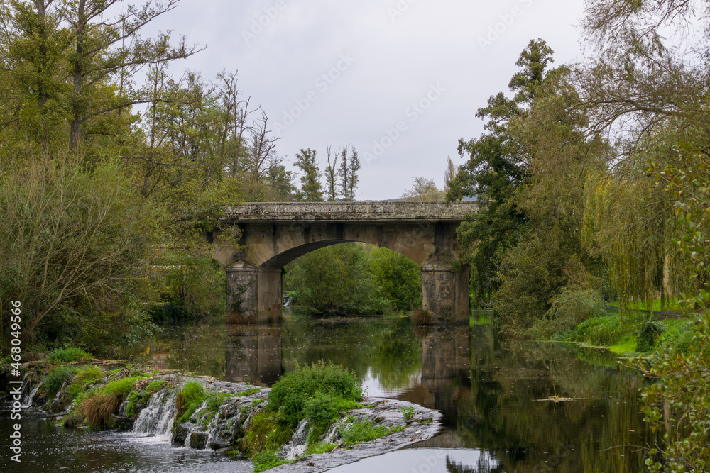 Fototapeta premium Roman bridge over river, Vilanova bridge, over the Arnoia river in Allariz, Ourense, Galicia, Spain