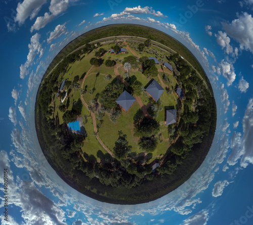 Globe panorama. stereographic projection of green park and ciy view. 360 degree panorama. little planet photo