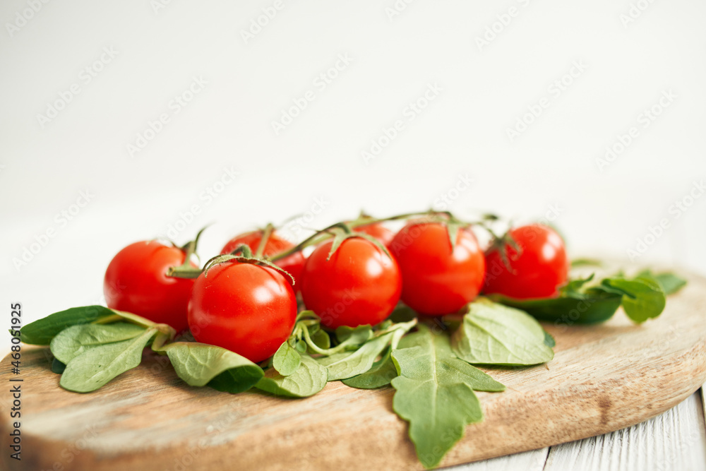 cherry tomatoes lettuce leaves wooden board fresh food