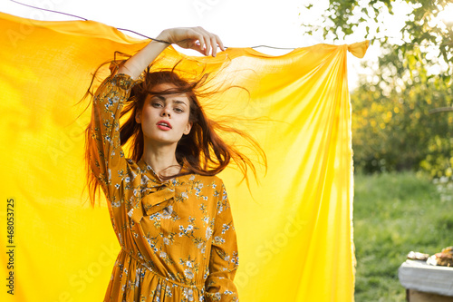 pretty woman in dress posing nature fashion glamor