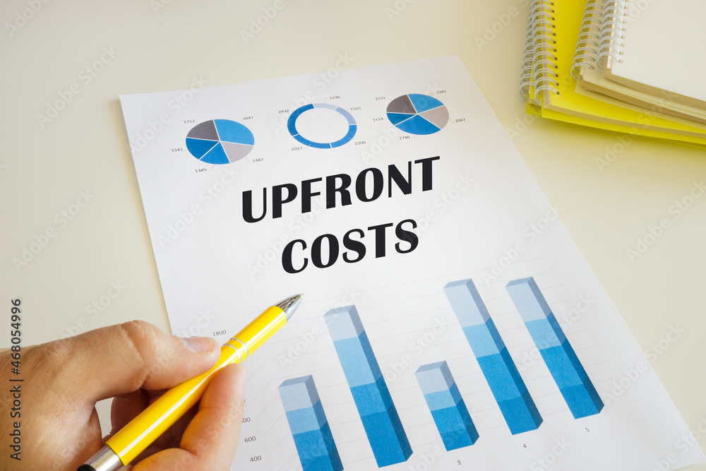 Business concept about UPFRONT COSTS with sign on the financial document. Business concept about UPFRONT COSTS with sign on the financial document.