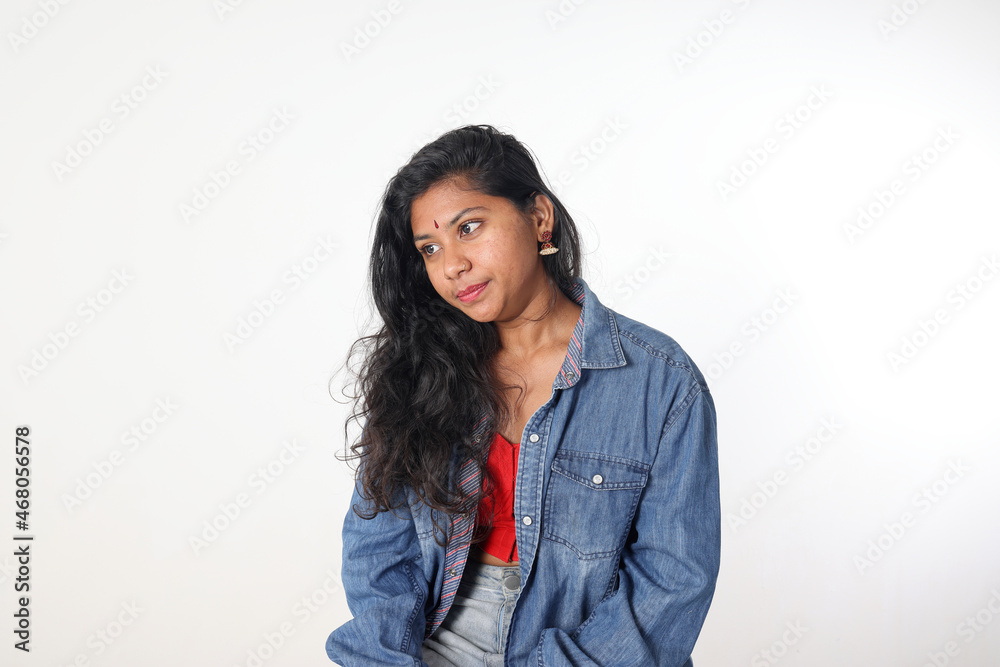Young attractive Asian Indian woman pose face body expression mode emotion on white background look down sad upset Young attractive Asian Indian woman pose face body expression mode emotion on white background look down sad upset