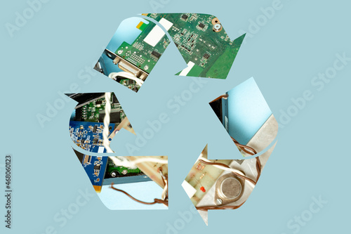 Old electronic parts inside of recycle symbol, on clean background, e waste concept, recycling electronics   photo